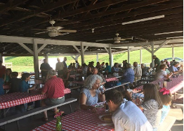 Holy Spirit Pavillion with familes enjoying a meal and fellowship